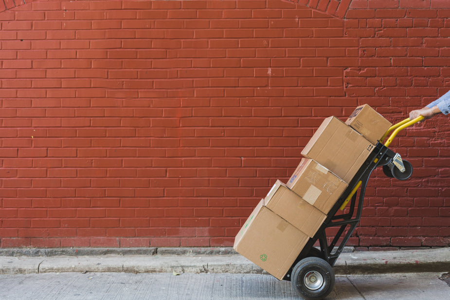 shipping boxes in front of red brick Entrepreneur's Kit Hub